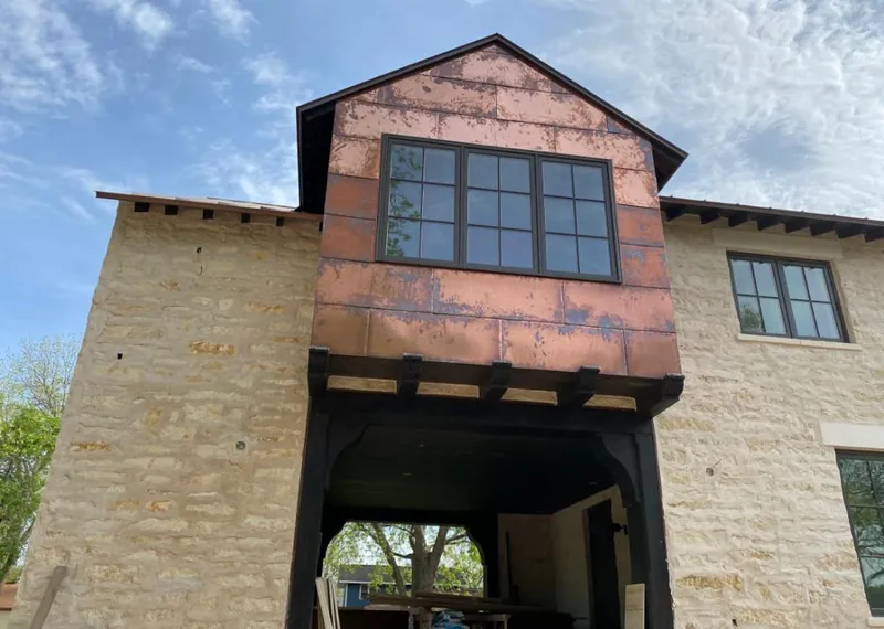 Copper metal panel facade on a stone building for Metal Roof Coating in Chena Ridge