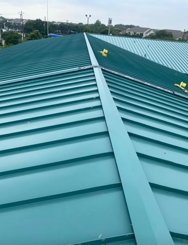 Green commercial metal roof ridge and valley for Metal Roof Repair in Chena Ridge