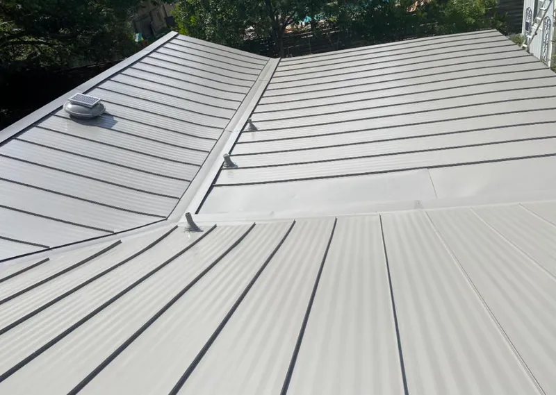Solar attic fan installed on a metal roof for Roof Ventilation in Chena Ridge